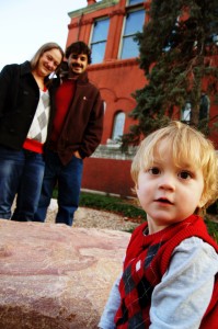 family, winter, toddler, little boy, parents in background, DOF,